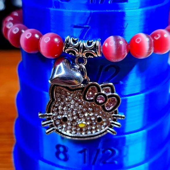 NWT Luminous "Hello Kitty" Pink Cat Eye Stretch Bracelet - Picture 3 of 3